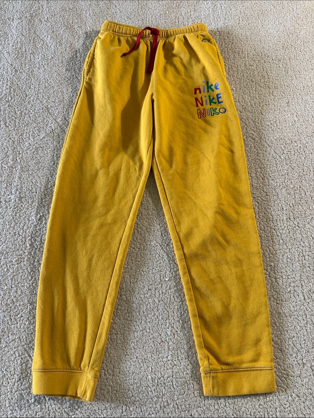 Nike Vintage Kids Yellow Fleece Joggers with Multicolor Logo and Red Drawcord XL